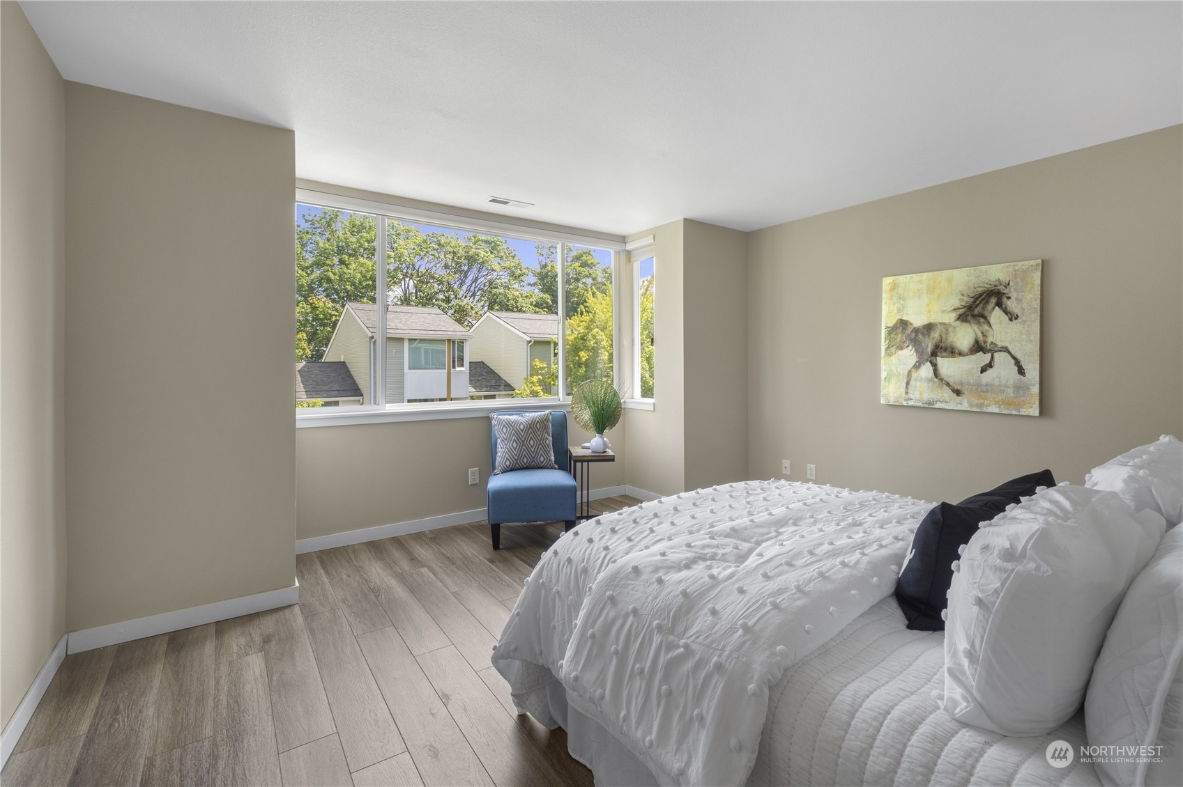 6713 35th Place South Seattle, WA 98118 - Photo 15 of 30 a bedroom with a large bed and a window