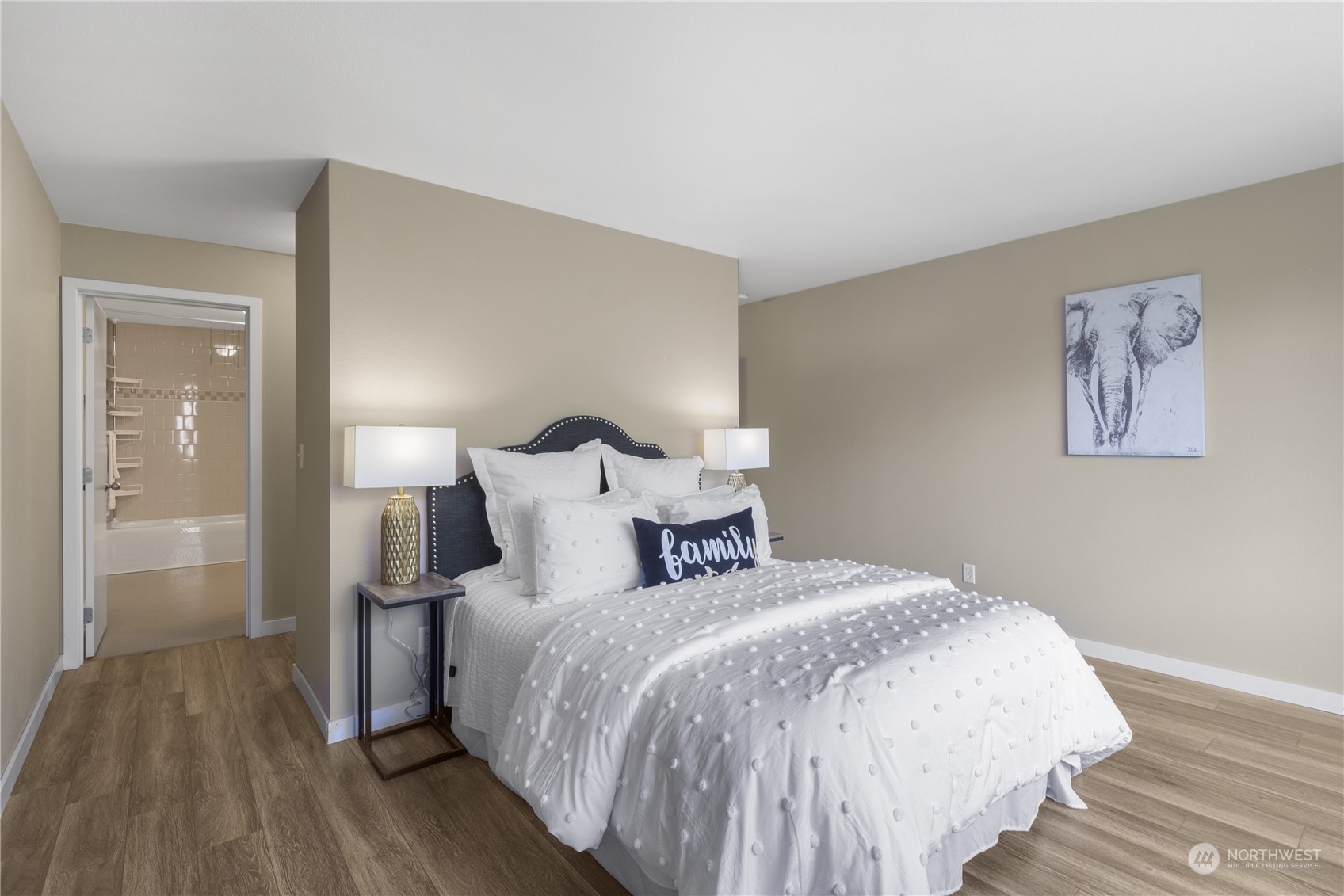 6713 35th Place South Seattle, WA 98118 - Photo 16 of 30 a bedroom with a bed and a night stand