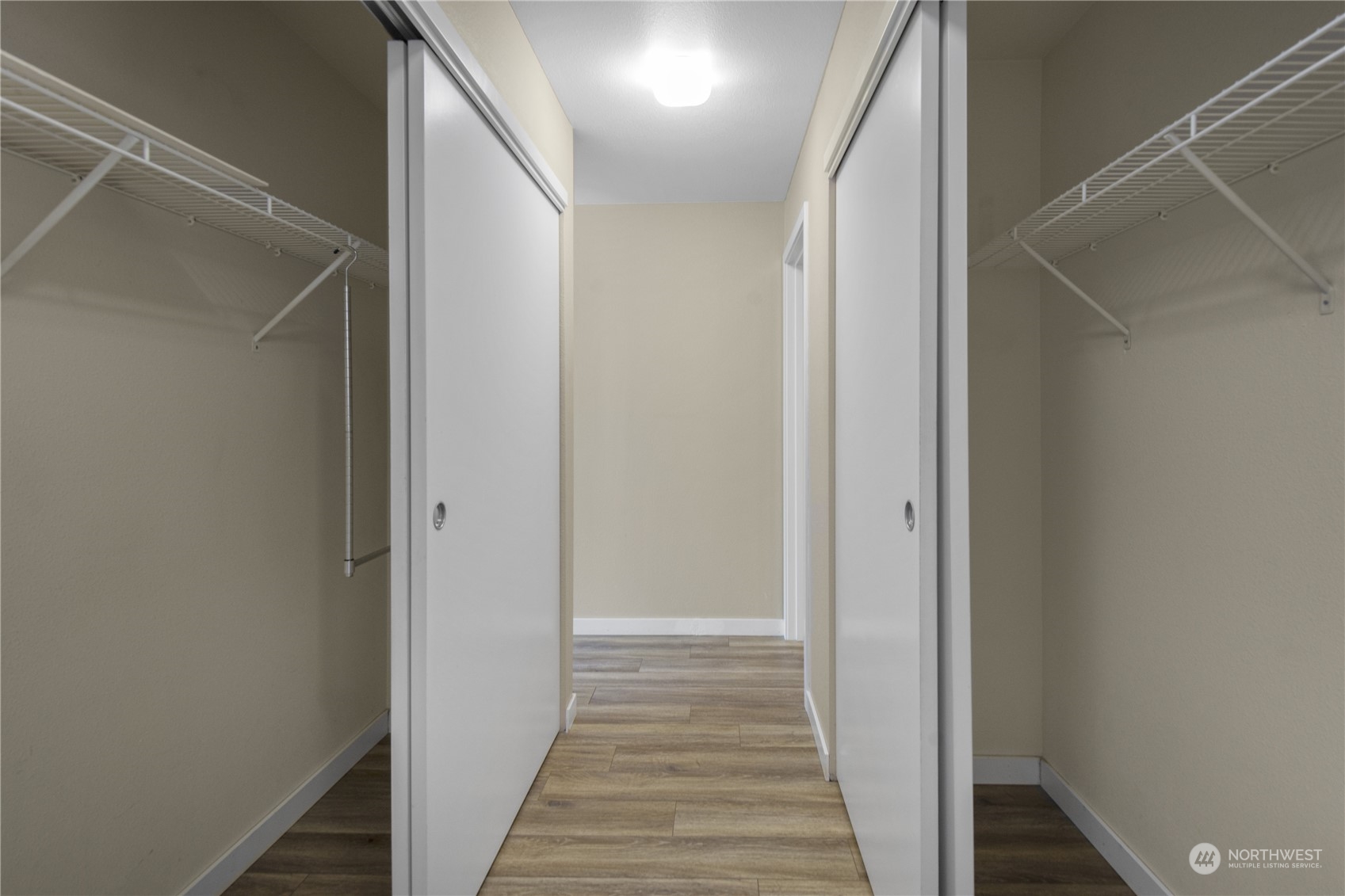 6713 35th Place South Seattle, WA 98118 - Photo 18 of 30 a view of a hallway with wooden floor and staircase