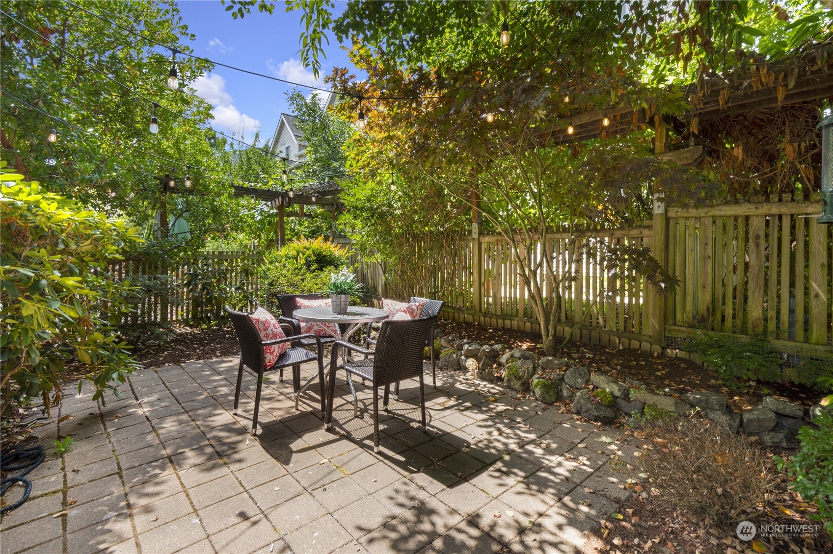 6713 35th Place South Seattle, WA 98118 - Photo 29 of 30 a backyard of a house with table and chairs