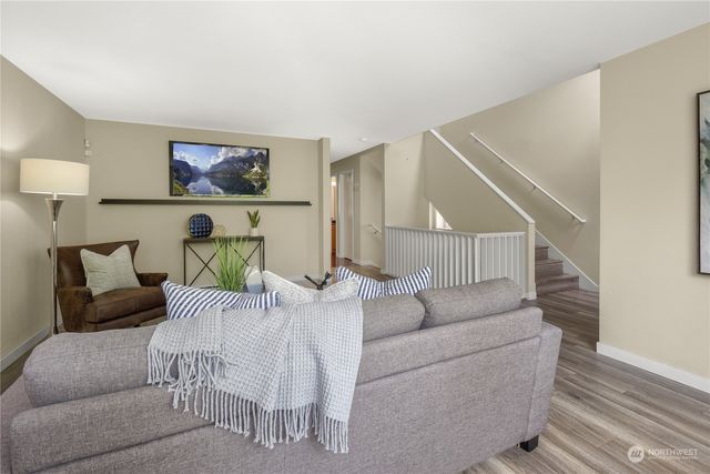 a living room with furniture and a painting