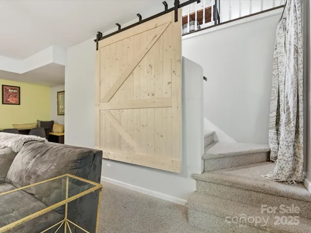 a living room with furniture and a rug