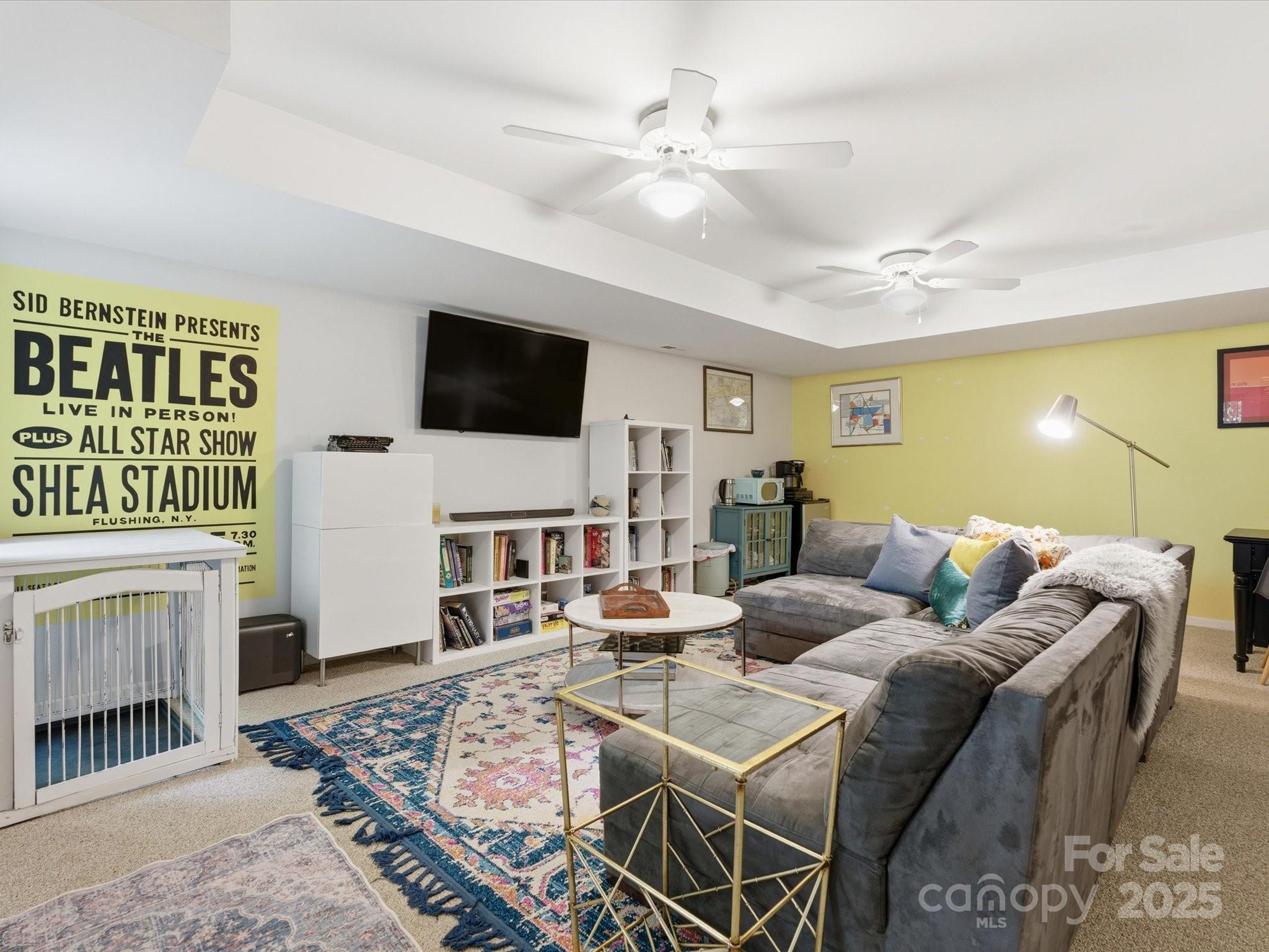 4002 Windward Drive Fort Mill, SC 29708 - Photo 17 of 41 a living room with furniture a fireplace and a flat screen tv