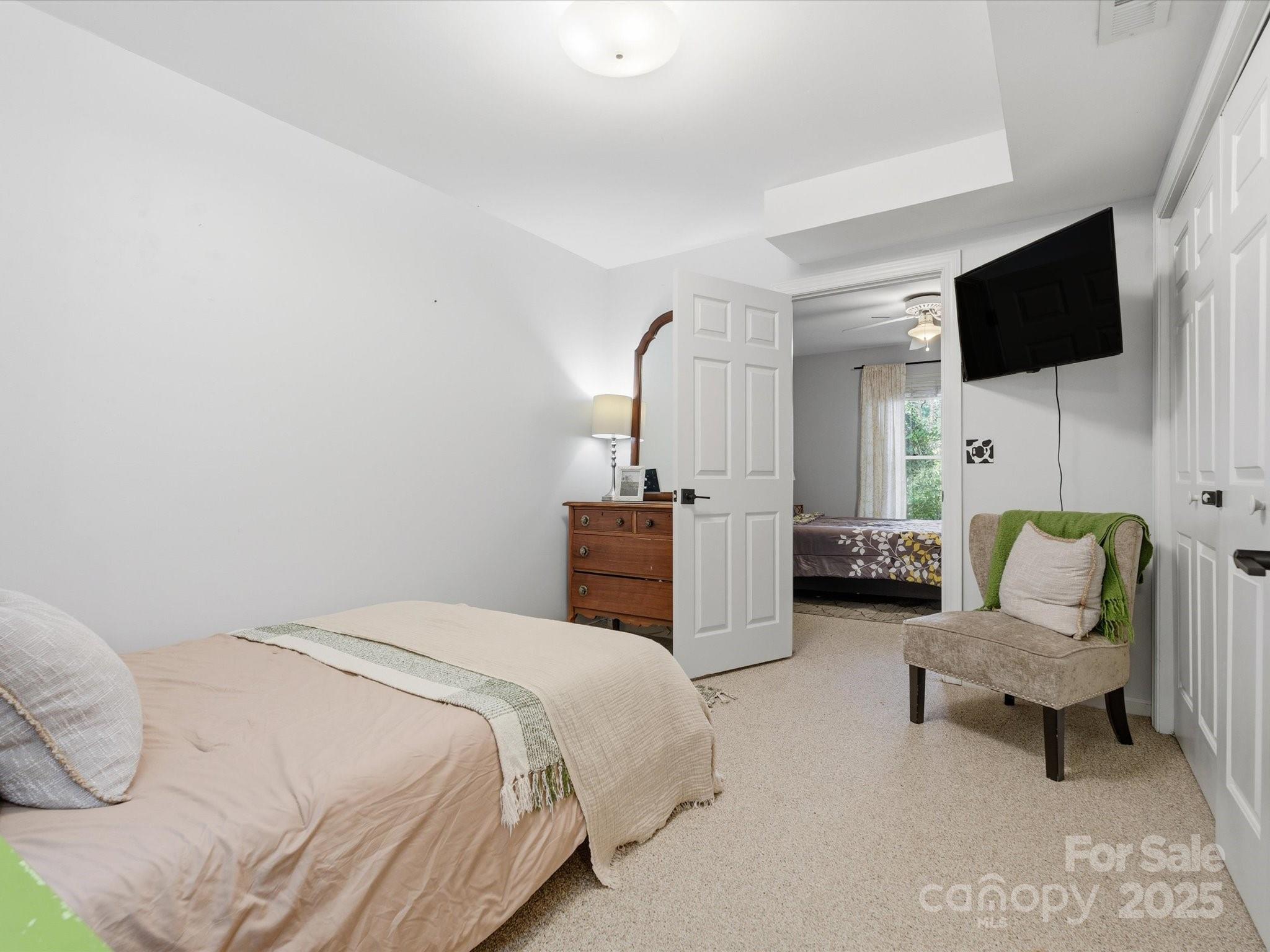 4002 Windward Drive Fort Mill, SC 29708 - Photo 27 of 41 a spacious bedroom with a bed and a flat screen tv