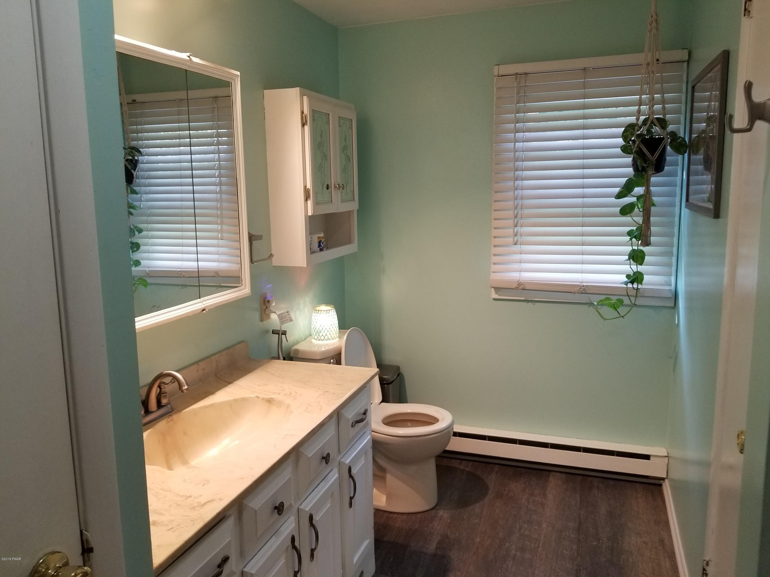 144 Mid Valley Road Lake Ariel, PA 18436 - Photo 31 of 55 a bathroom with a sink toilet and shower
