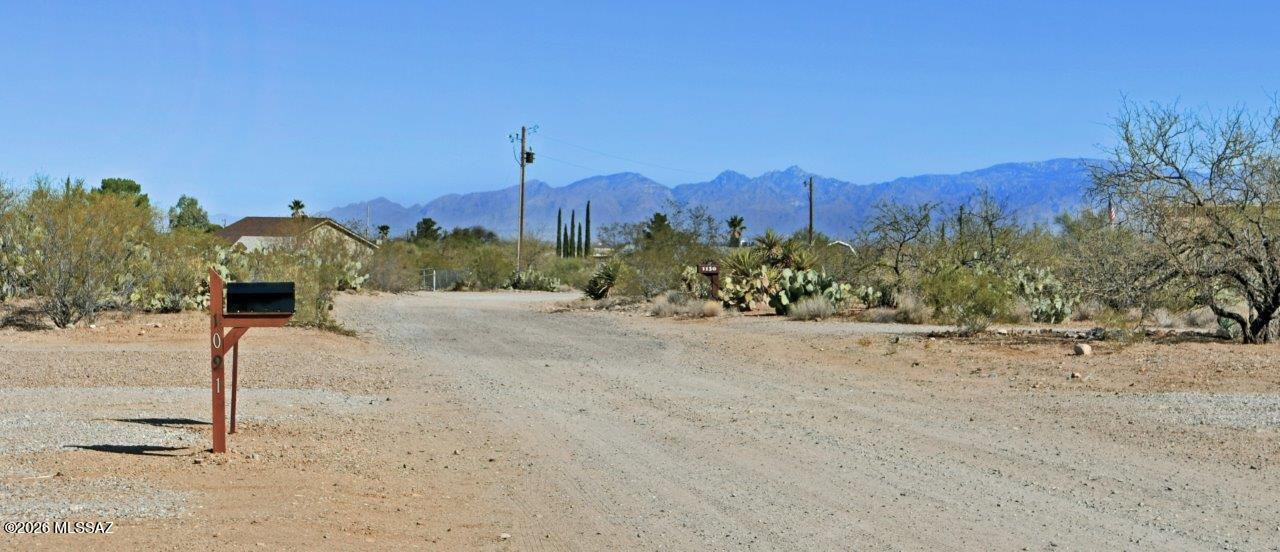 1091 North Vail View Road Vail, AZ 85641 - Photo 41 of 43 a view of a road with a building in the background