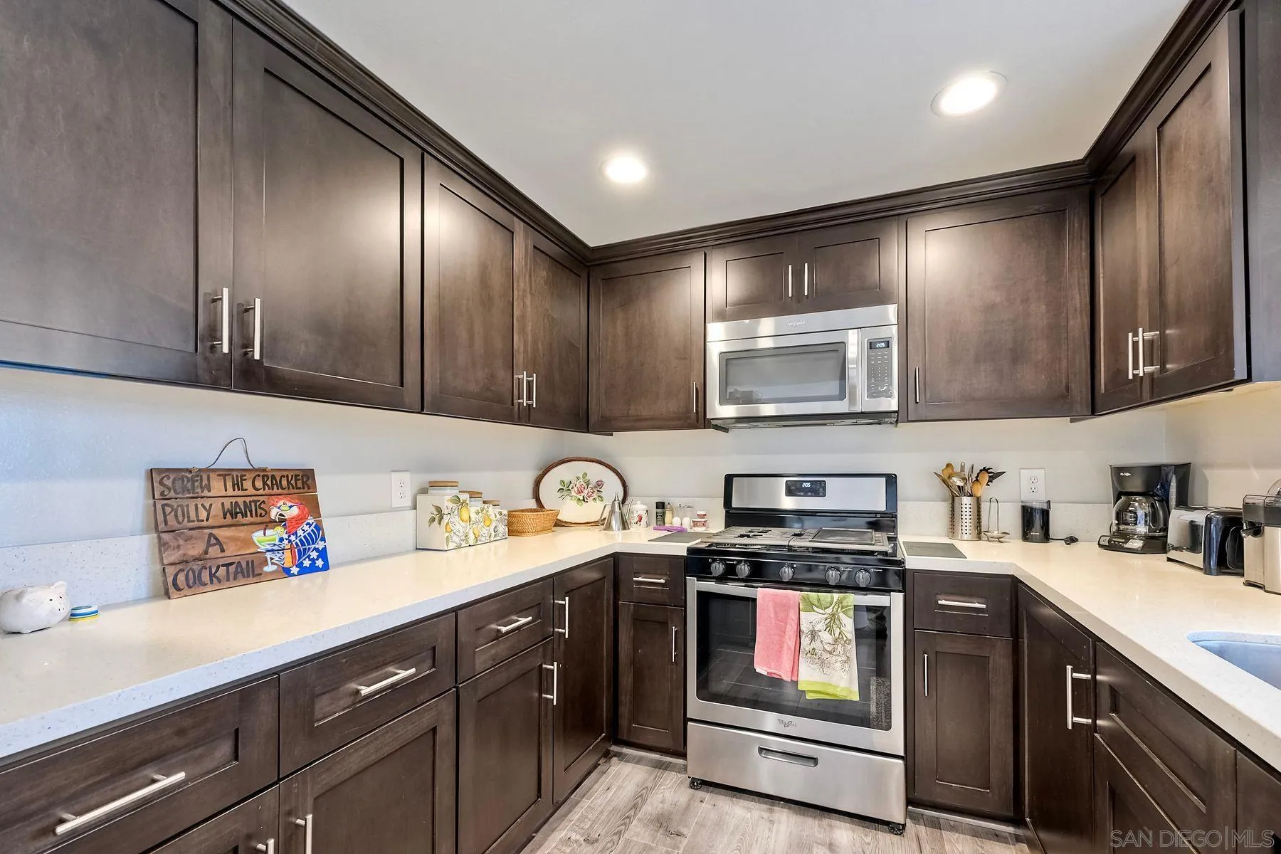 1122 Iris Avenue Imperial Beach, CA 91932 - Photo 13 of 35 a kitchen with stainless steel appliances granite countertop a refrigerator and a stove top oven