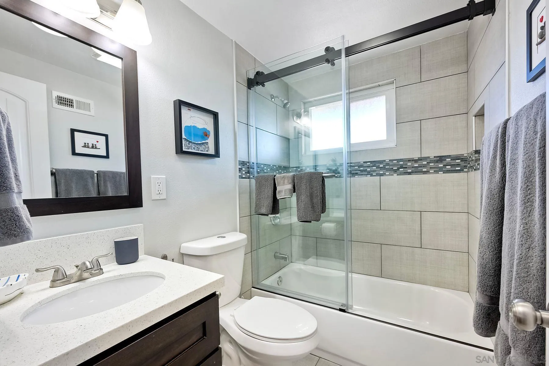 1122 Iris Avenue Imperial Beach, CA 91932 - Photo 19 of 35 a bathroom with a sink a toilet and shower