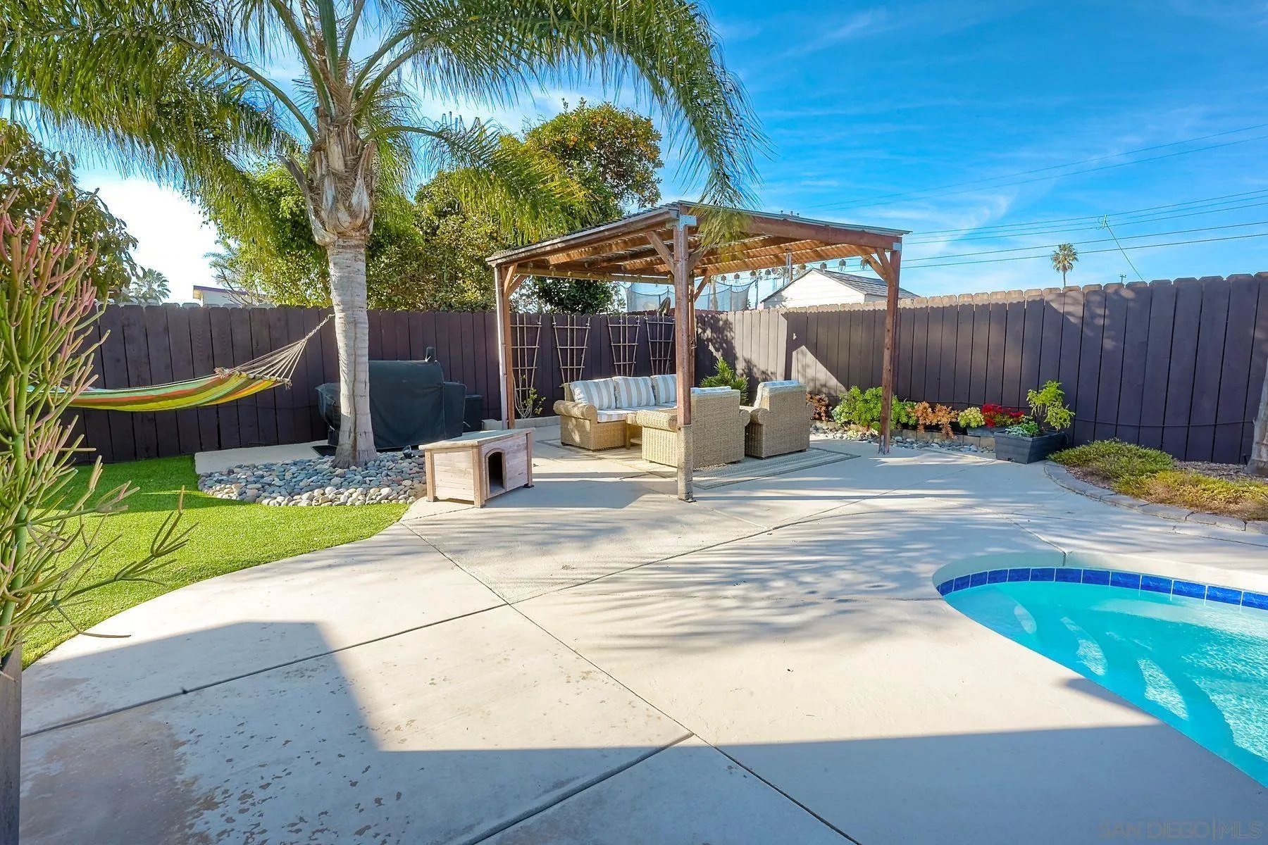 1122 Iris Avenue Imperial Beach, CA 91932 - Photo 2 of 35 a backyard of a house with table and chairs
