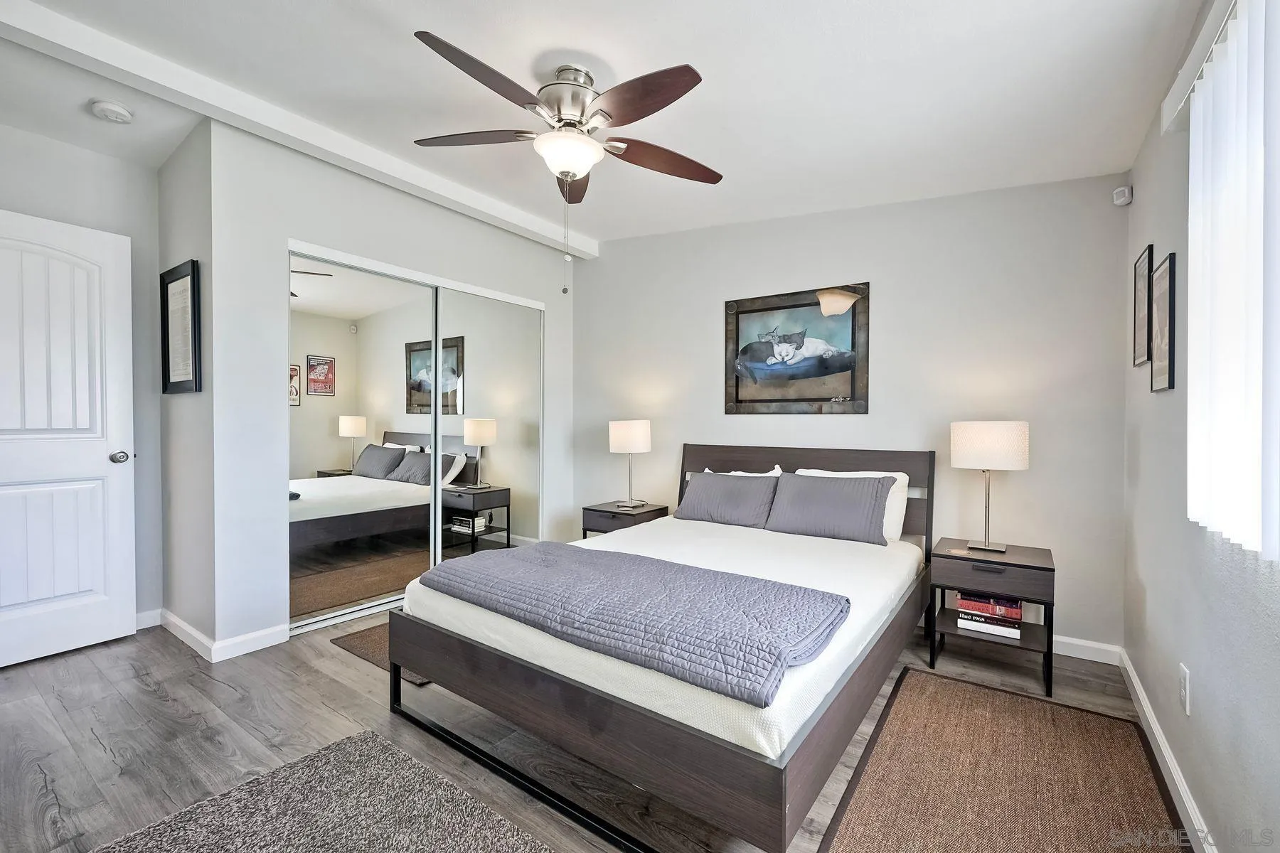 1122 Iris Avenue Imperial Beach, CA 91932 - Photo 21 of 35 a bedroom with a bed a table and painting