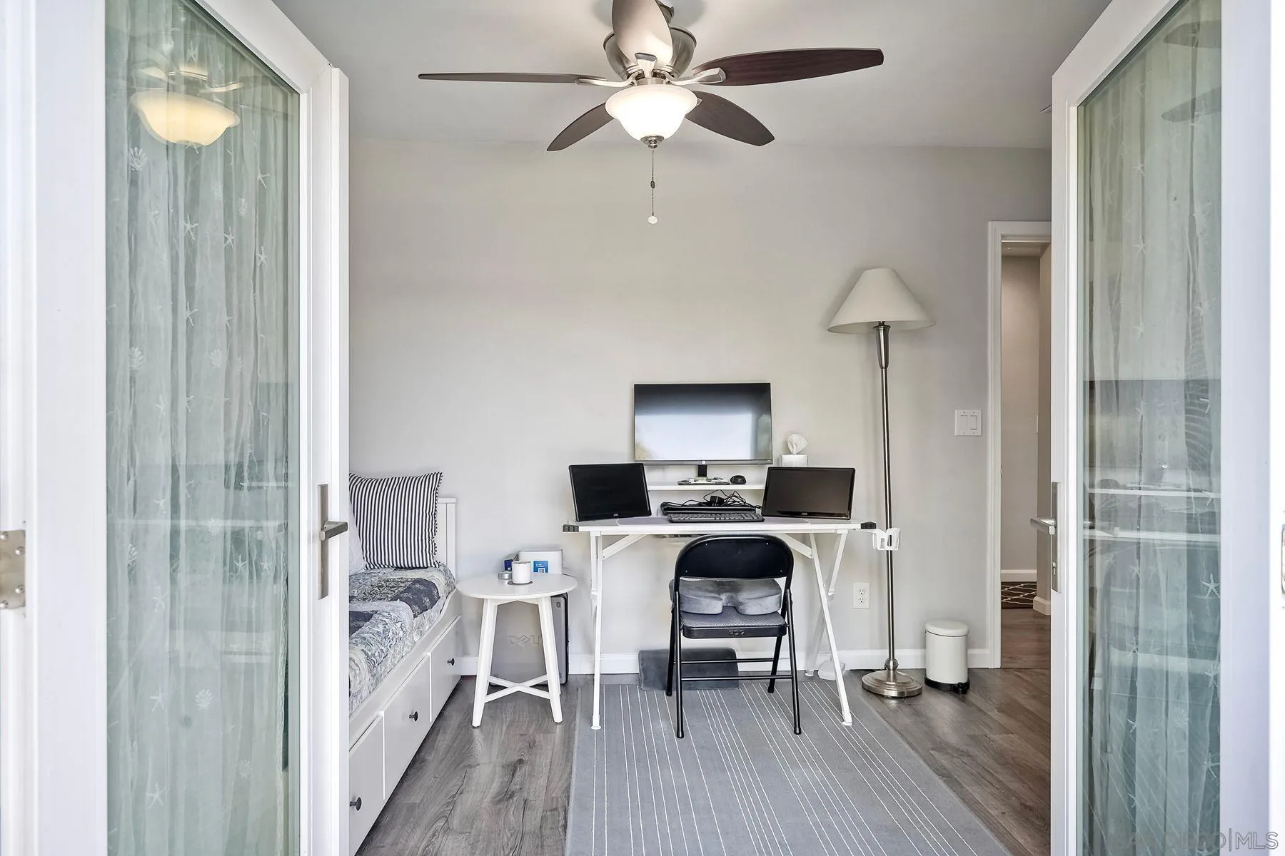 1122 Iris Avenue Imperial Beach, CA 91932 - Photo 25 of 35 a view of a workspace with furniture and wooden floor