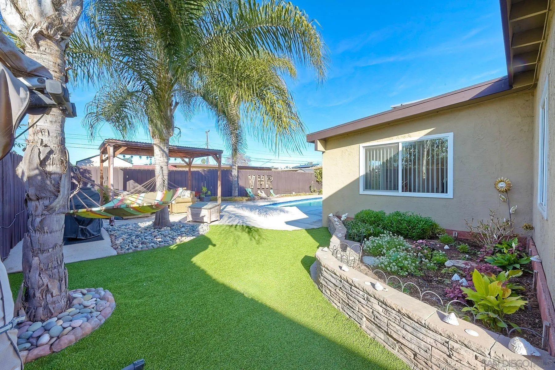 1122 Iris Avenue Imperial Beach, CA 91932 - Photo 28 of 35 a view of a backyard with plants garden and swimming pool