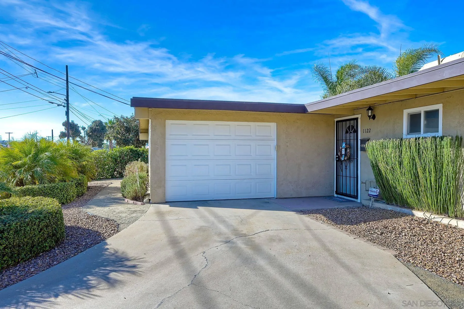 1122 Iris Avenue Imperial Beach, CA 91932 - Photo 31 of 35 a front view of a house with a yard