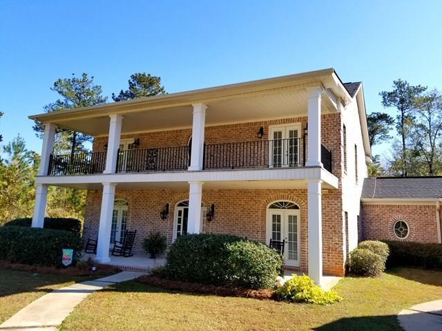 415 Wheeler Road Gray, GA 31032 - Photo 2 of 25 a front view of a house with a yard