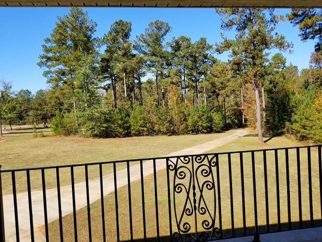 415 Wheeler Road Gray, GA 31032 - Photo 12 of 25 a balcony with trees in the background