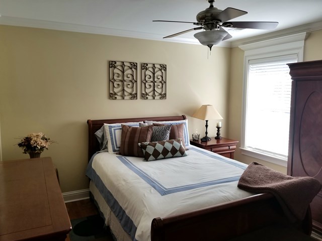 415 Wheeler Road Gray, GA 31032 - Photo 13 of 25 a bedroom with a bed and a potted plant