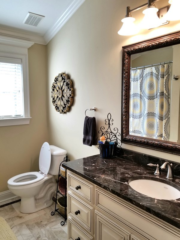 415 Wheeler Road Gray, GA 31032 - Photo 14 of 25 a bathroom with a toilet and a sink