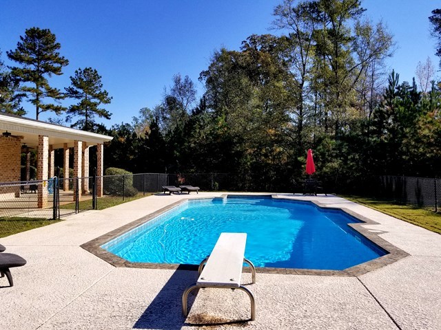 415 Wheeler Road Gray, GA 31032 - Photo 17 of 25 a view of a swimming pool with an outdoor seating