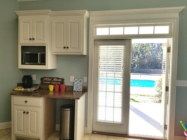 415 Wheeler Road Gray, GA 31032 - Photo 21 of 25 a kitchen with stainless steel appliances white cabinets and a window
