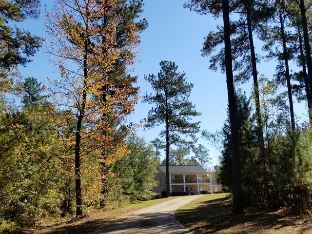 415 Wheeler Road Gray, GA 31032 - Photo 25 of 25 a front view of a house with trees and yard