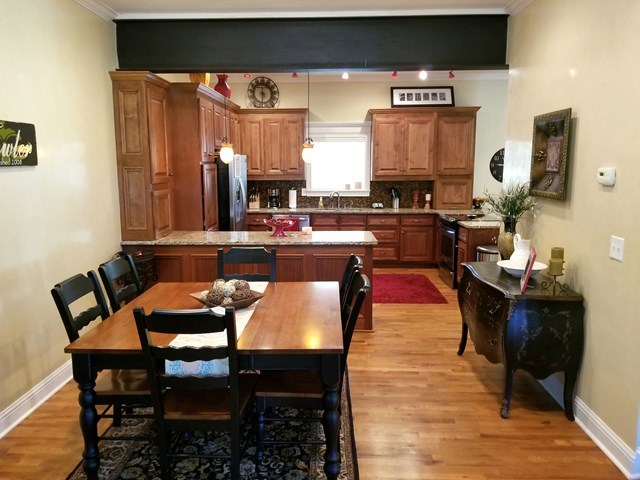415 Wheeler Road Gray, GA 31032 - Photo 6 of 25 a dining room with furniture and wooden floor