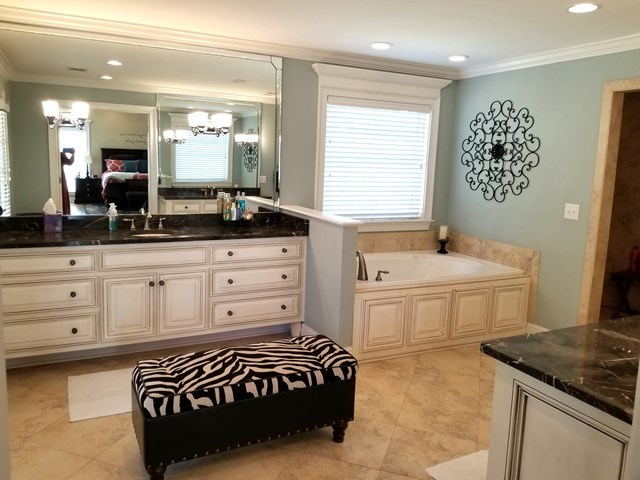 415 Wheeler Road Gray, GA 31032 - Photo 9 of 25 a spacious bathroom with a granite countertop sink and a bathtub