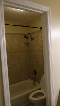 a room with gym equipment and a flat screen tv