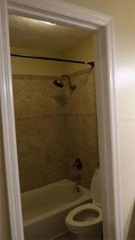 a room with gym equipment and a flat screen tv