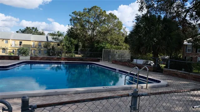 a view of a house with wooden fence