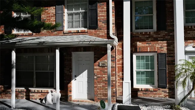 a kitchen with a refrigerator sink and cabinets