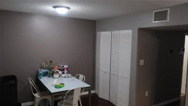 a view of a hallway that has a door in it