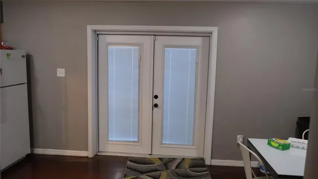 a white toilet sitting next to a bathroom sink