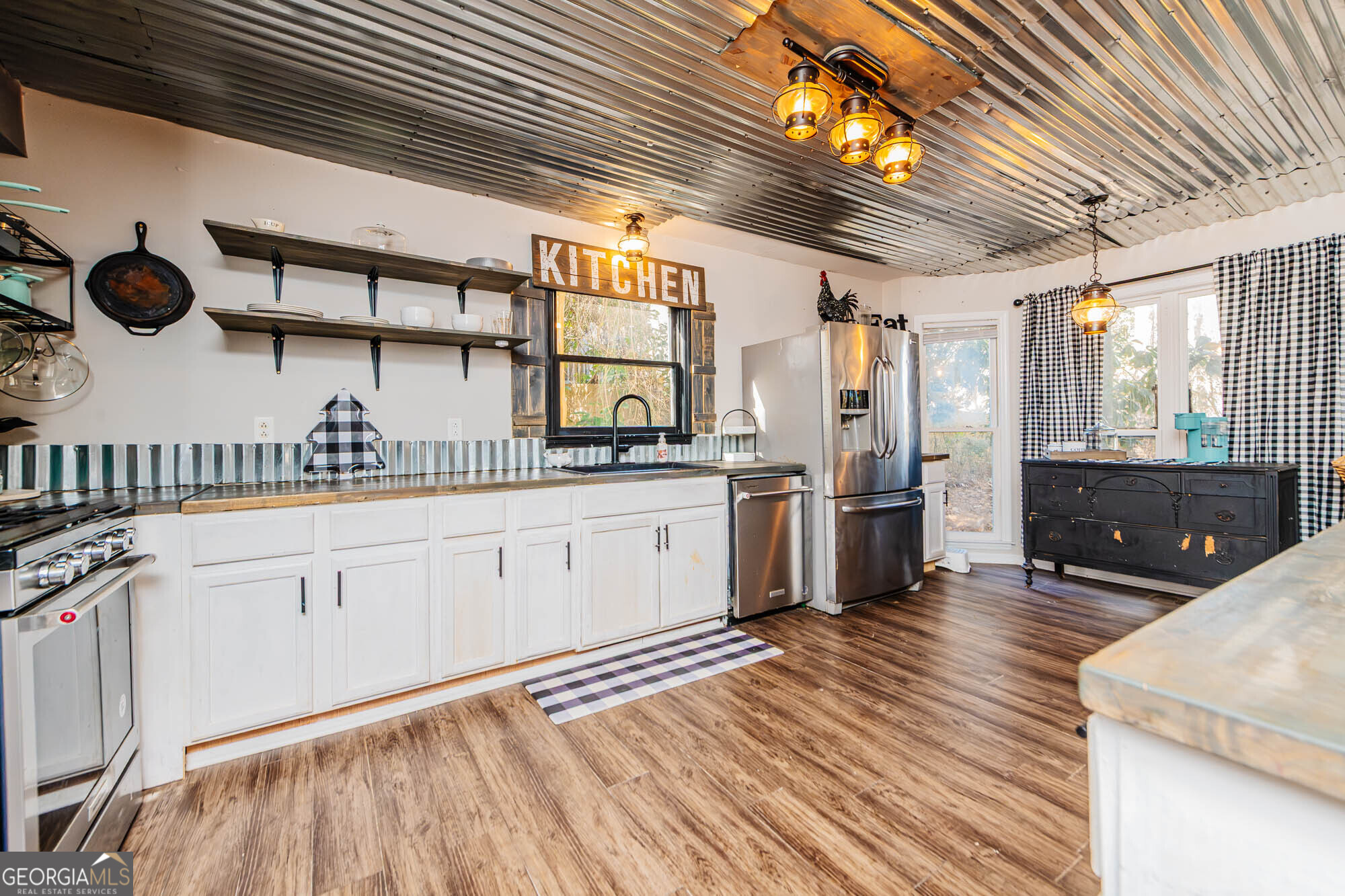 5341 Northside Drive Macon, GA 31210 - Photo 12 of 43 a kitchen with stainless steel appliances granite countertop a sink a stove and cabinets