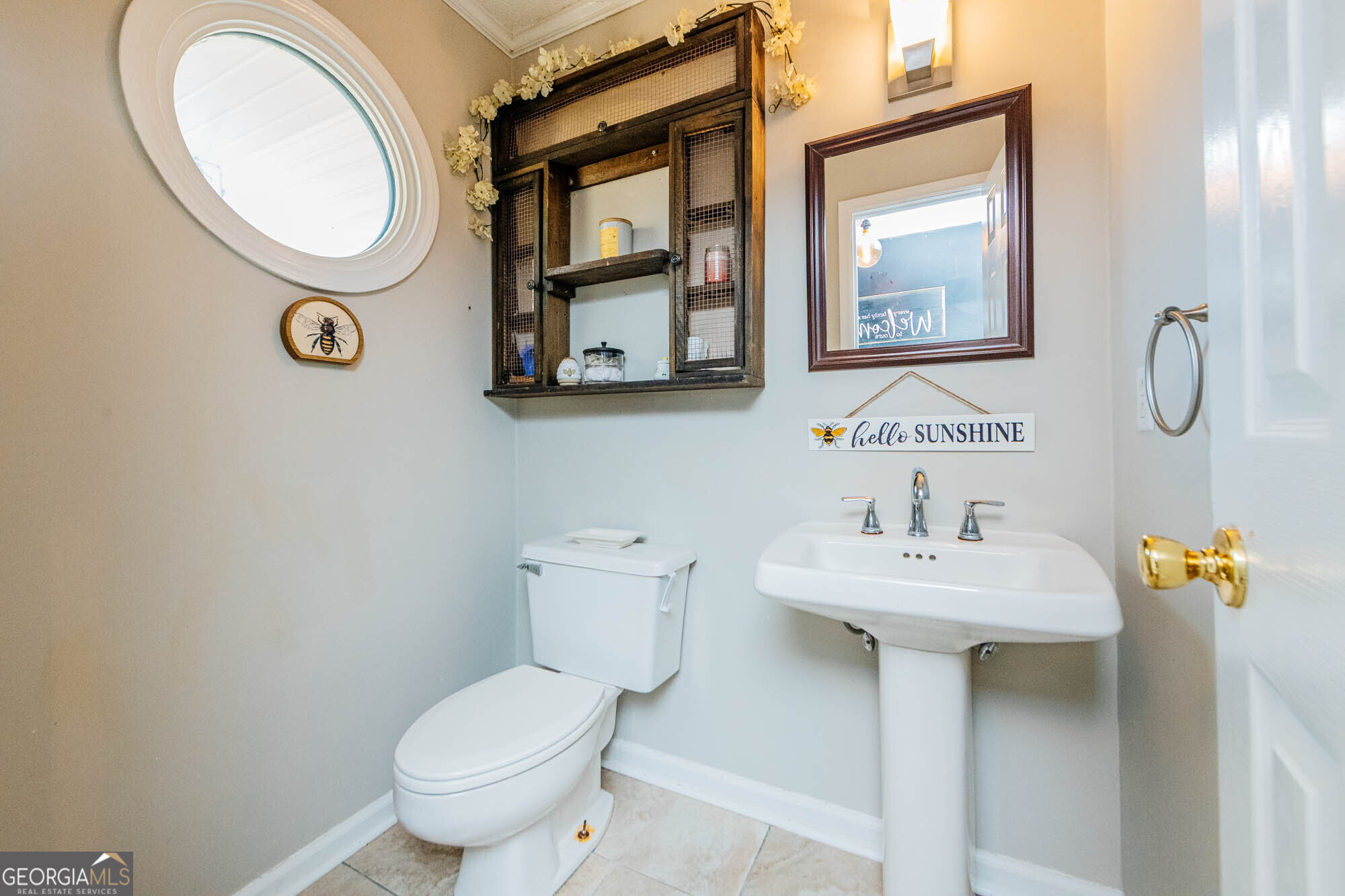 5341 Northside Drive Macon, GA 31210 - Photo 16 of 43 a bathroom with a toilet sink and mirror