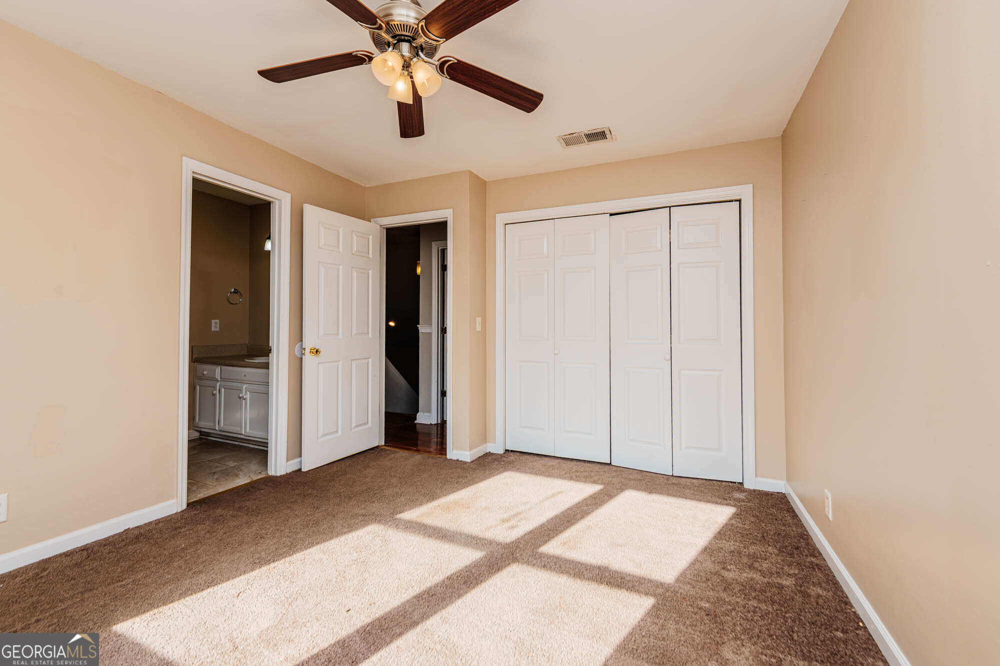 5341 Northside Drive Macon, GA 31210 - Photo 22 of 43 a view of a big room with wooden floor and entryway in a room