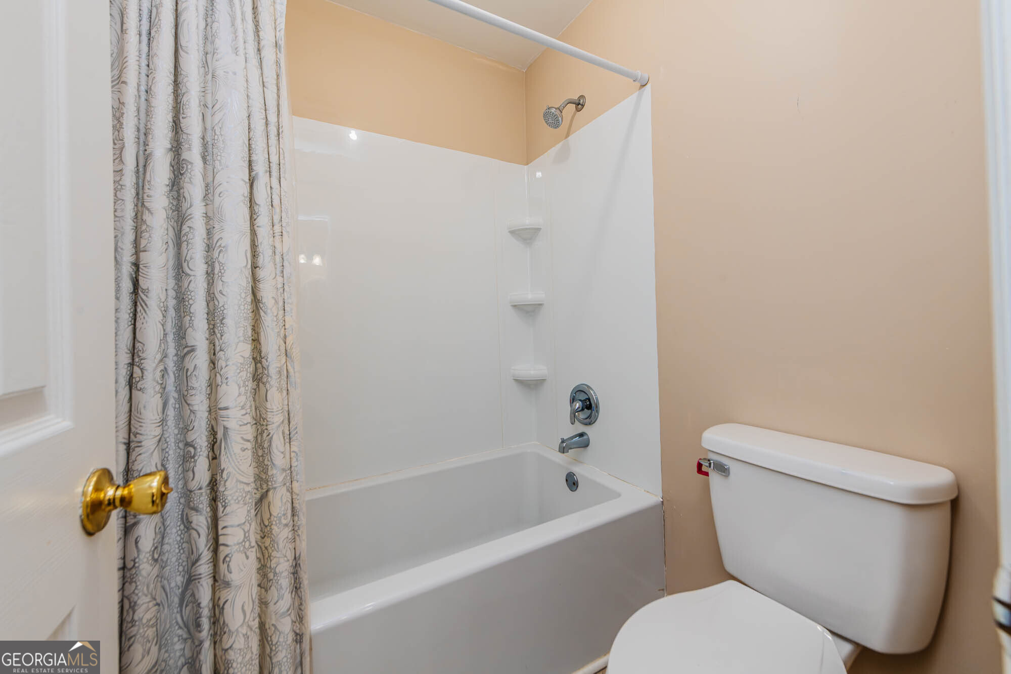 5341 Northside Drive Macon, GA 31210 - Photo 24 of 43 a white toilet sitting next to a bath tub