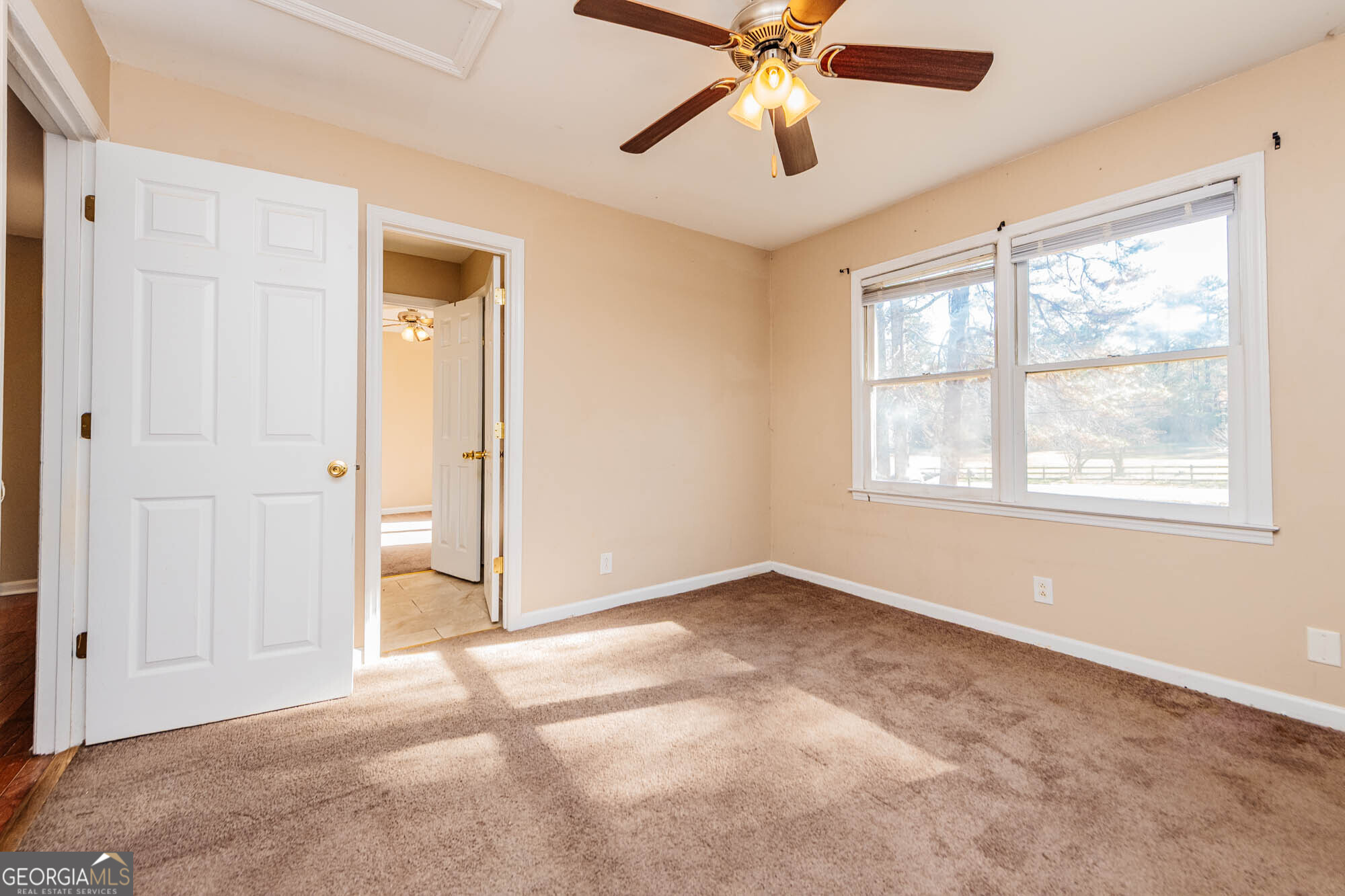 5341 Northside Drive Macon, GA 31210 - Photo 26 of 43 an empty room with windows and fan