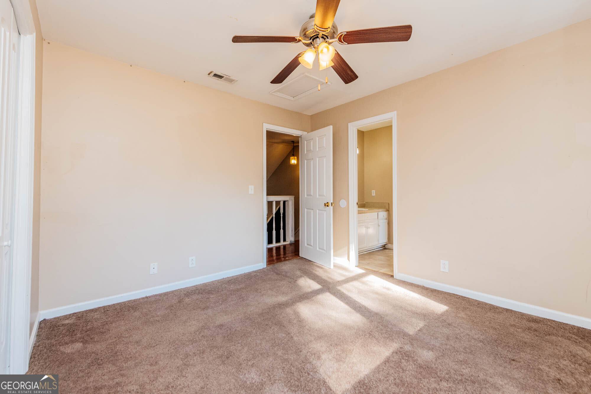 5341 Northside Drive Macon, GA 31210 - Photo 27 of 43 an empty room with a ceiling fan and a window