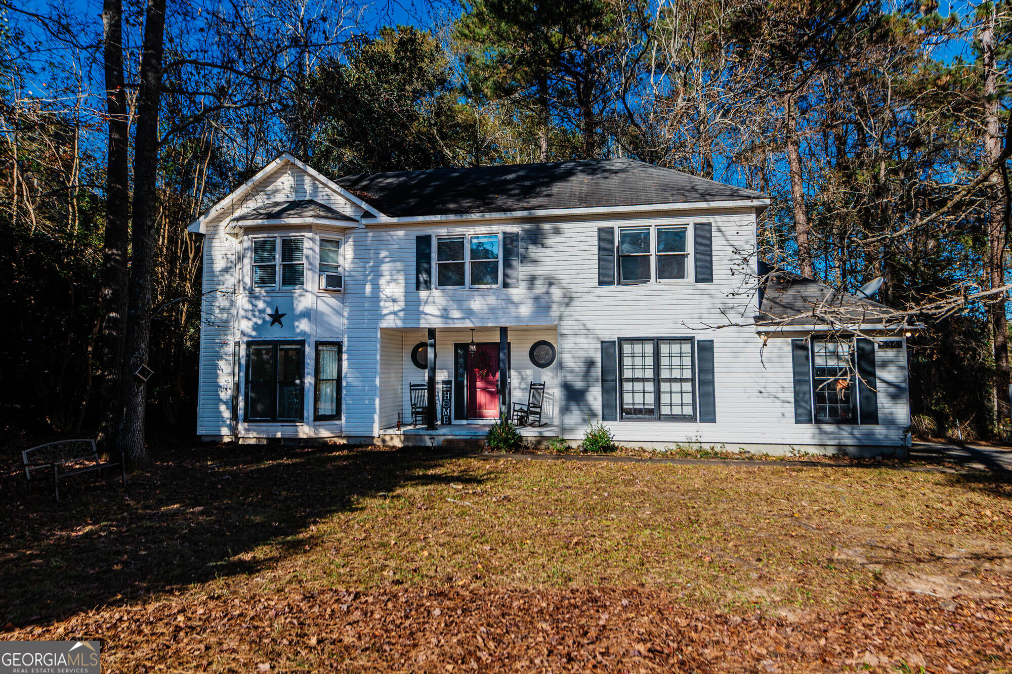 5341 Northside Drive Macon, GA 31210 - Photo 3 of 43 a front view of a house with lots of trees and plants