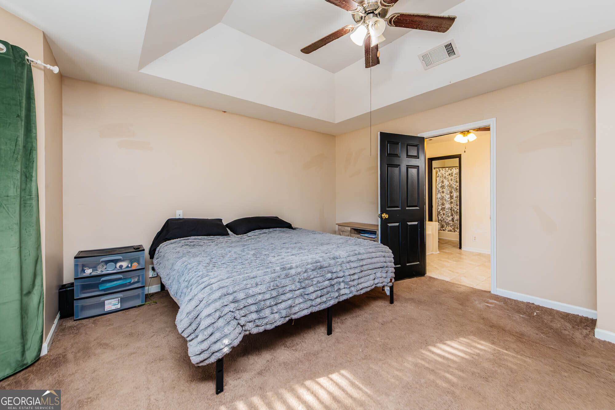 5341 Northside Drive Macon, GA 31210 - Photo 36 of 43 a bedroom with a bed and a chandelier