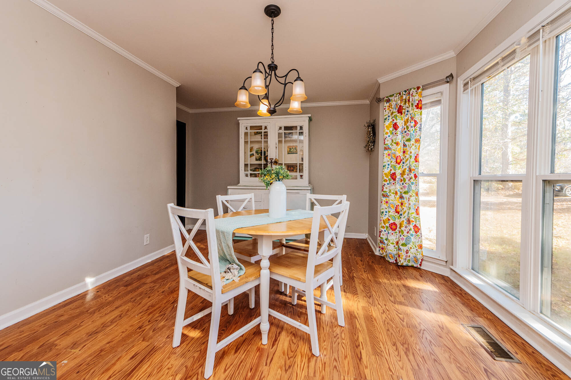 5341 Northside Drive Macon, GA 31210 - Photo 6 of 43 a dining room with furniture window wooden floor and a chandelier
