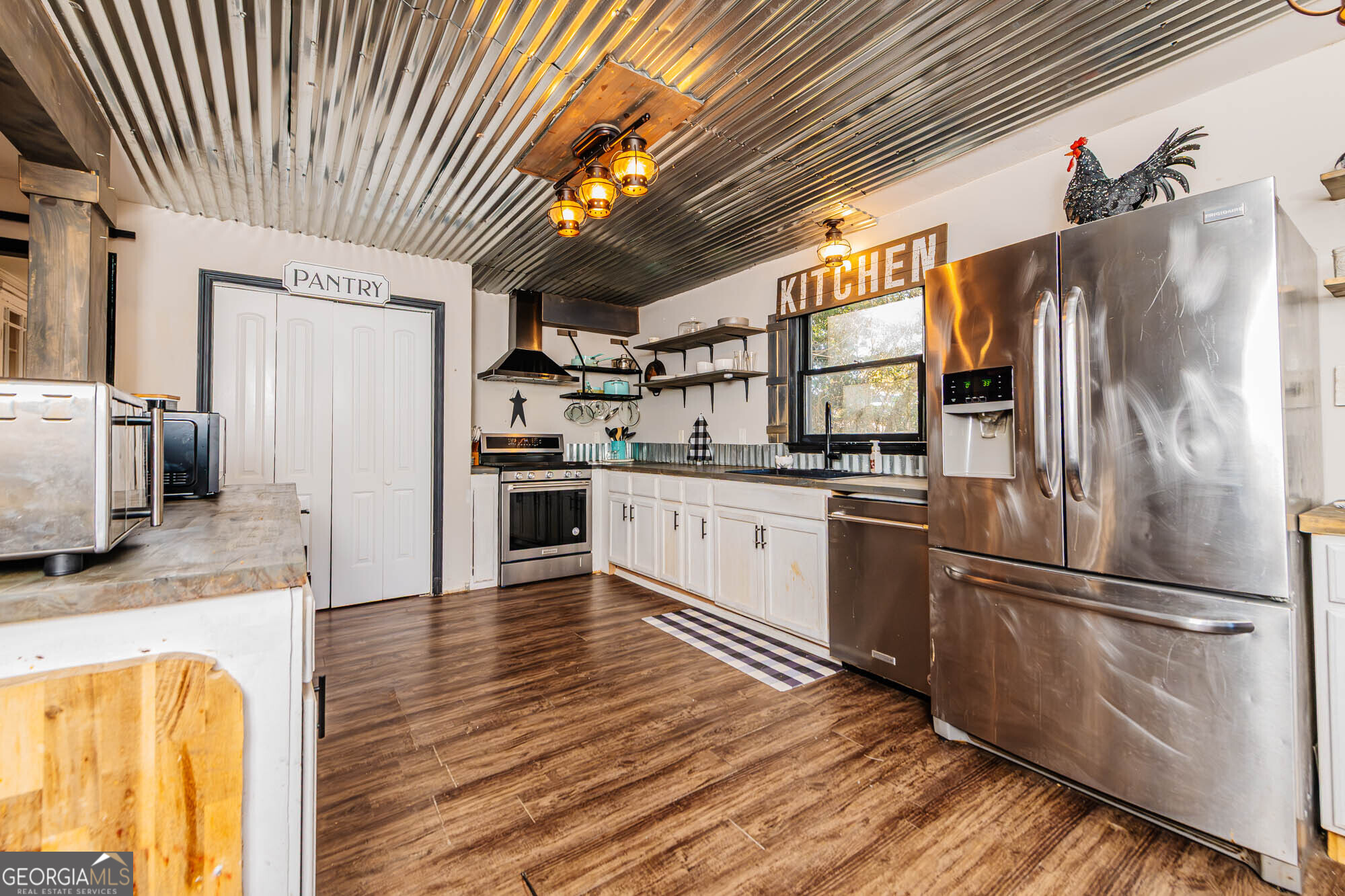5341 Northside Drive Macon, GA 31210 - Photo 9 of 43 a kitchen with stainless steel appliances granite countertop a refrigerator a stove and a sink