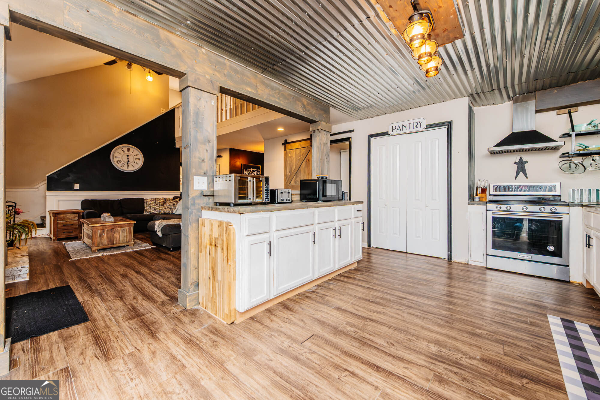 5341 Northside Drive Macon, GA 31210 - Photo 10 of 43 a kitchen with stainless steel appliances granite countertop a stove a sink and a refrigerator