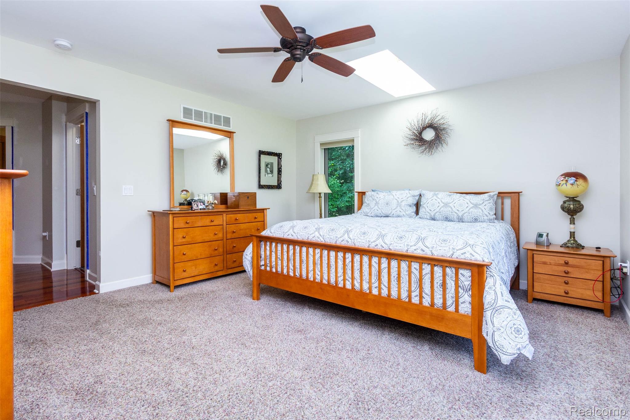 9887 Hadley Road Clarkston, MI 48348 - Photo 18 of 56 Carpeted bedroom featuring a skylight, ceiling fan, and recessed lighting