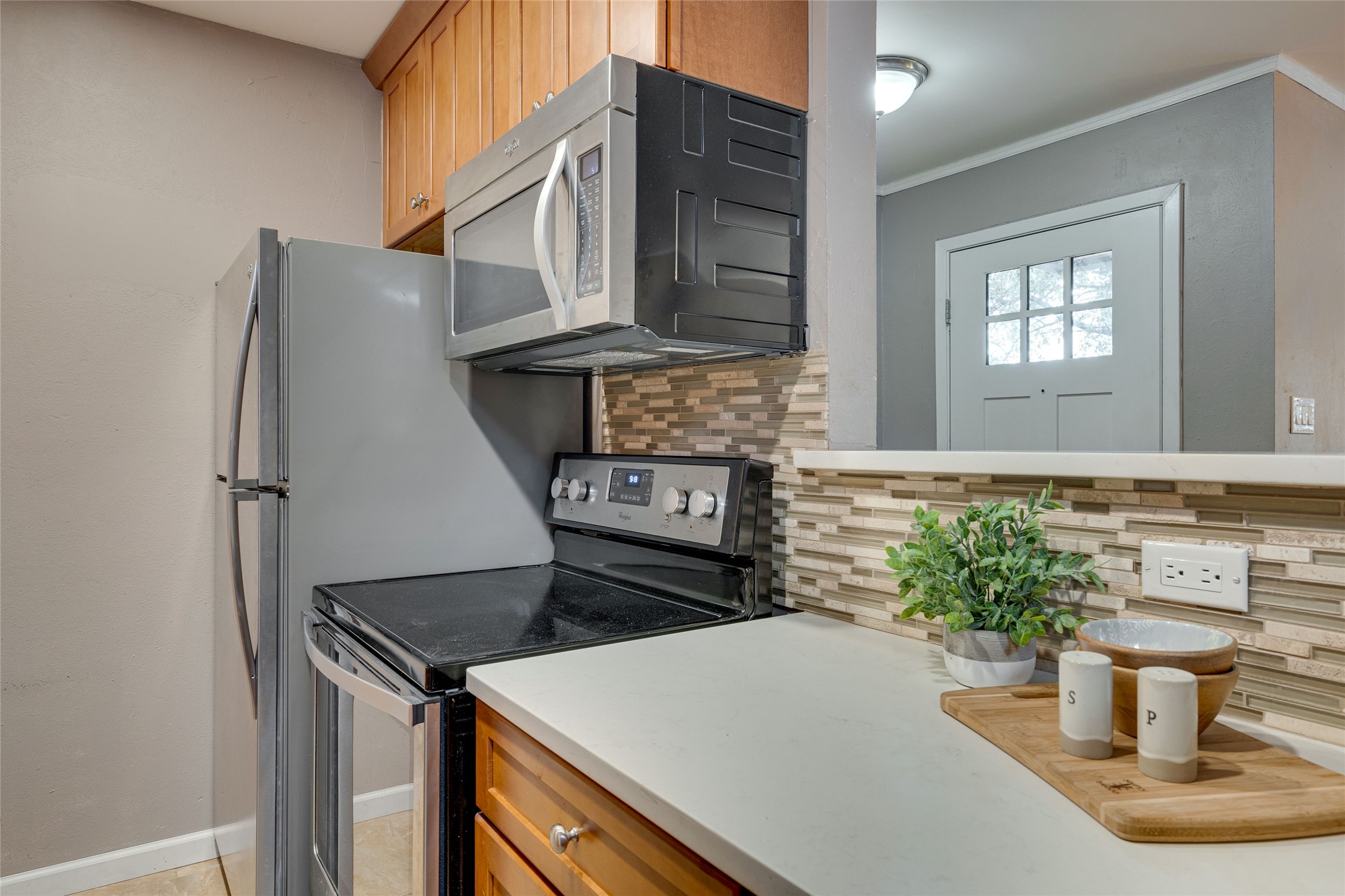 4159 Steck Avenue, Unit 290 Austin, TX 78759 - Photo 13 of 38 a kitchen with a stove and a microwave