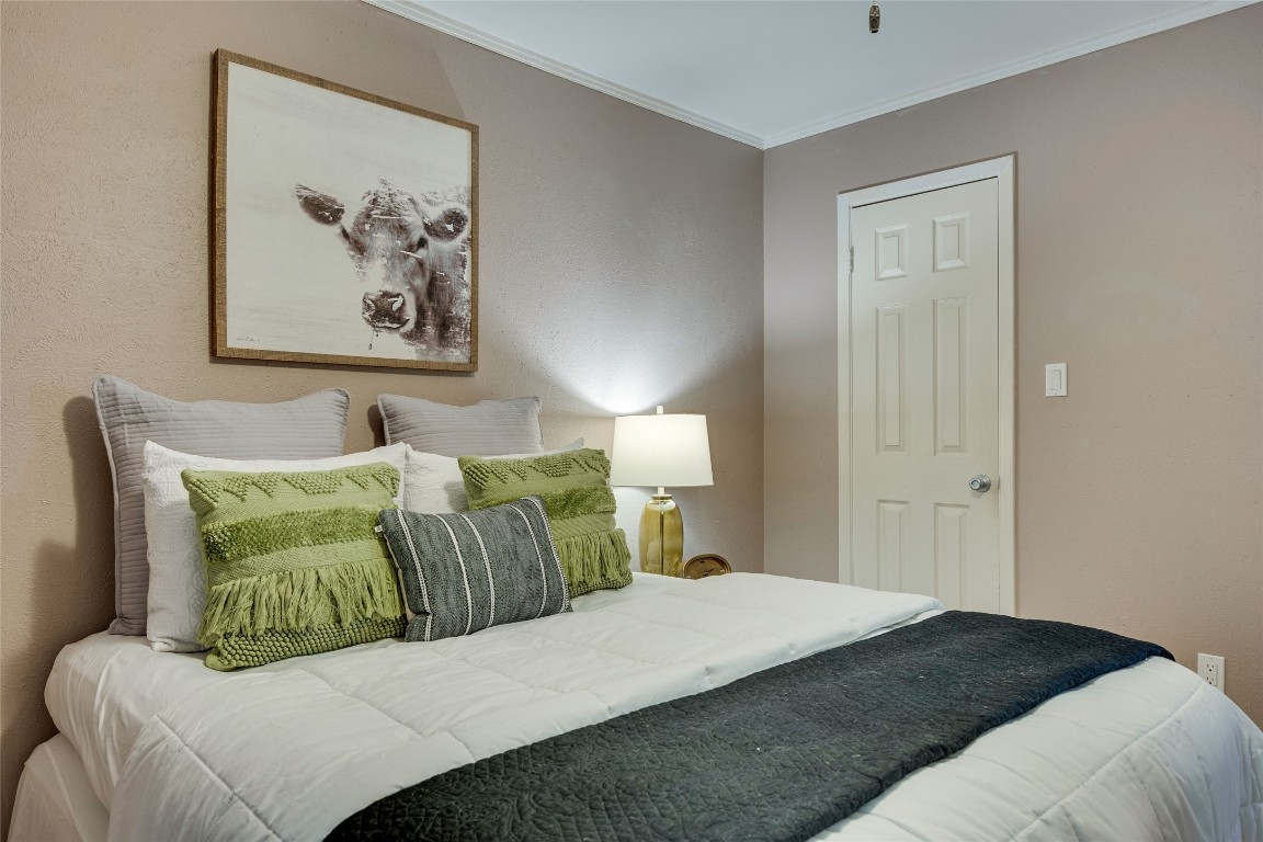 4159 Steck Avenue, Unit 290 Austin, TX 78759 - Photo 21 of 38 a bedroom with a bed and painting on the wall