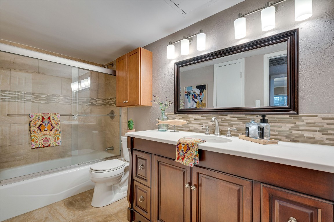 4159 Steck Avenue, Unit 290 Austin, TX 78759 - Photo 24 of 38 a bathroom with a toilet sink and mirror