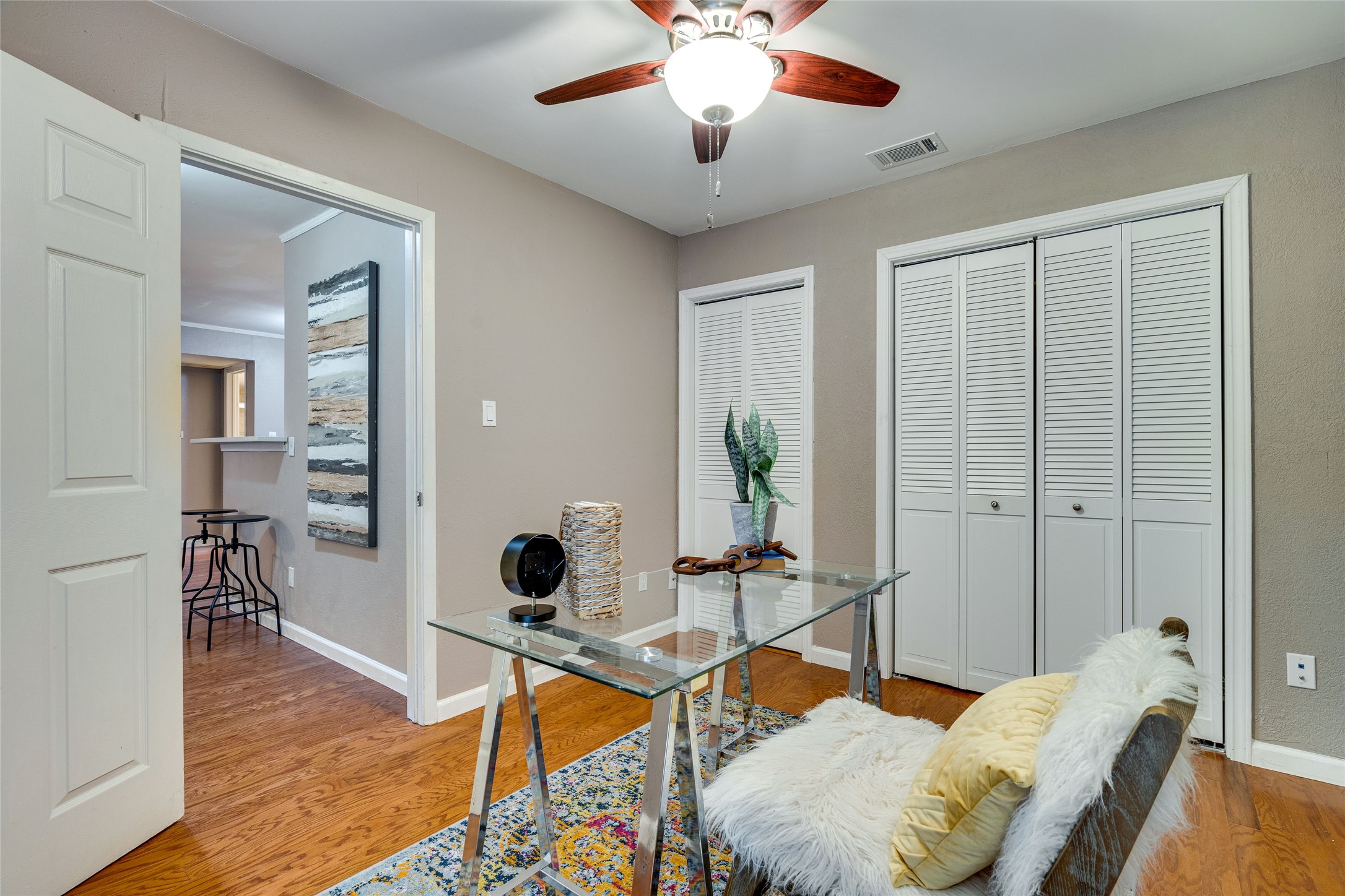 4159 Steck Avenue, Unit 290 Austin, TX 78759 - Photo 25 of 38 a living room with furniture and wooden floor