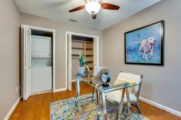 a dining room with furniture and wooden floor