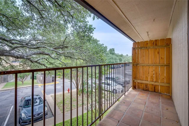 a view of a house with pool and sitting area